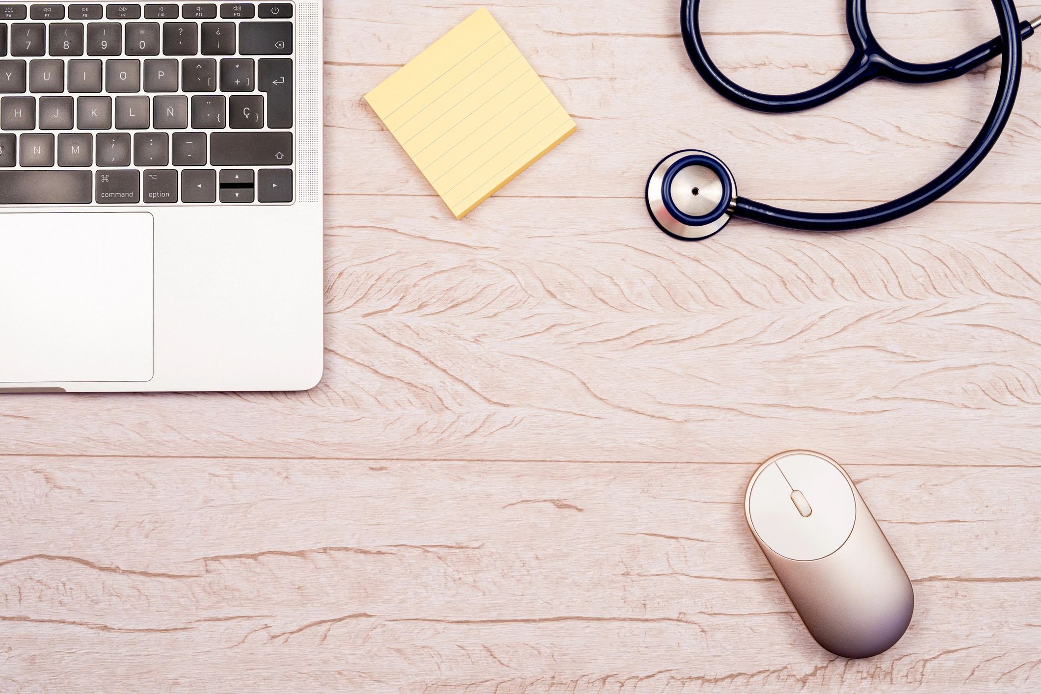 Medical workspace with laptop and stethoscope, representing online EMS education