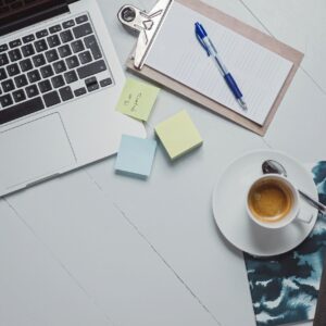 Online paramedic course workspace with laptop and medical training tools (no patients)